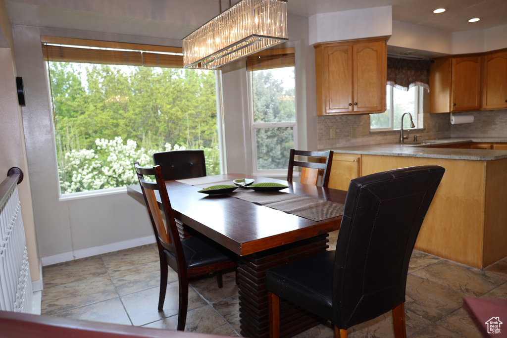 Dining space with baseboards and recessed lighting