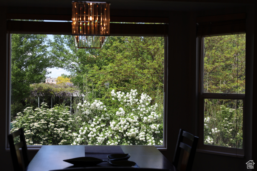 Dining space with a chandelier and healthy amount of natural light