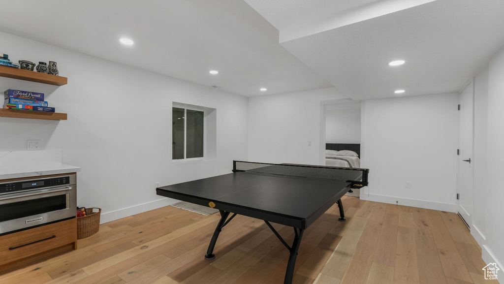 Rec room featuring light wood-style flooring, recessed lighting, and baseboards