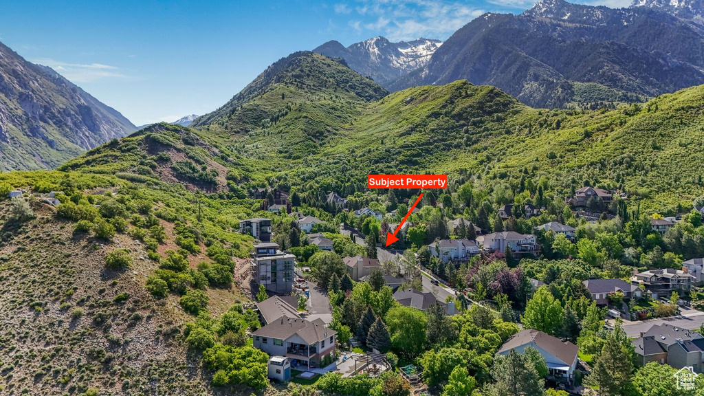 View of mountain backdrop featuring nearby suburban area