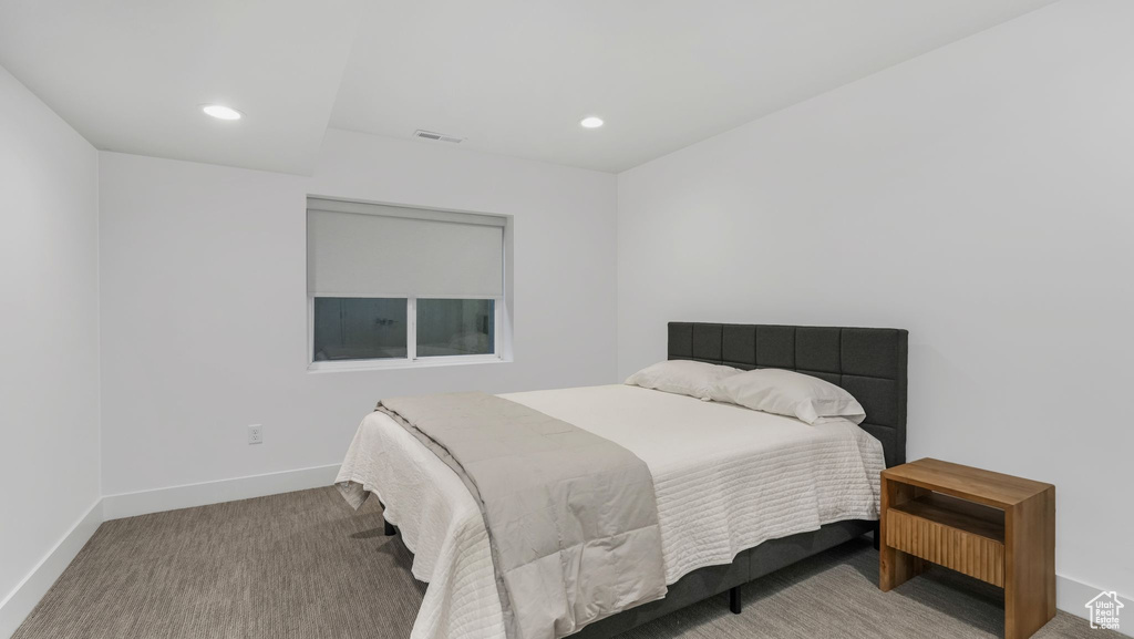 Bedroom with baseboards, recessed lighting, and carpet flooring