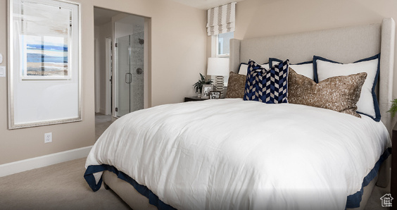 Carpeted bedroom with baseboards