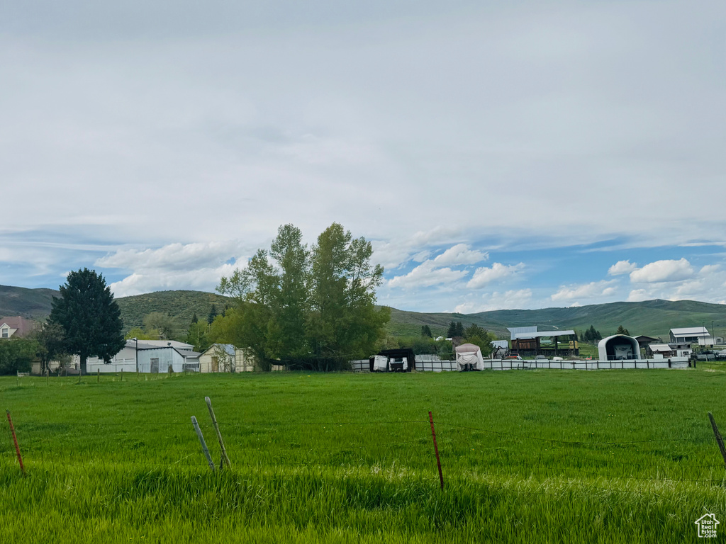 View of yard with a mountain view and a view of countryside