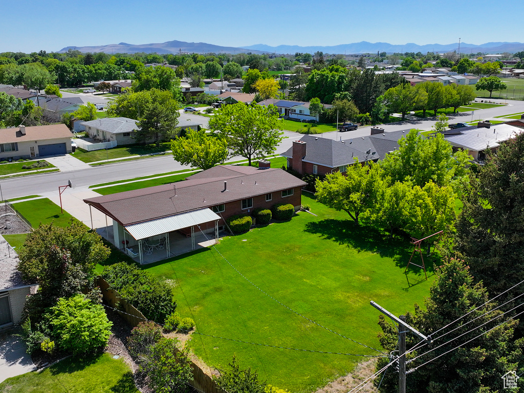 Aerial perspective of suburban area with a mountainous background