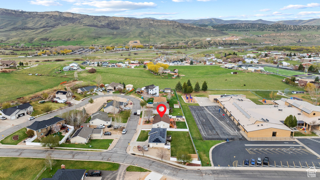 Birds eye view of property with a mountain view