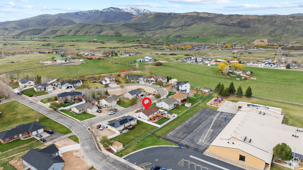 Drone / aerial view featuring a residential view and a mountain view