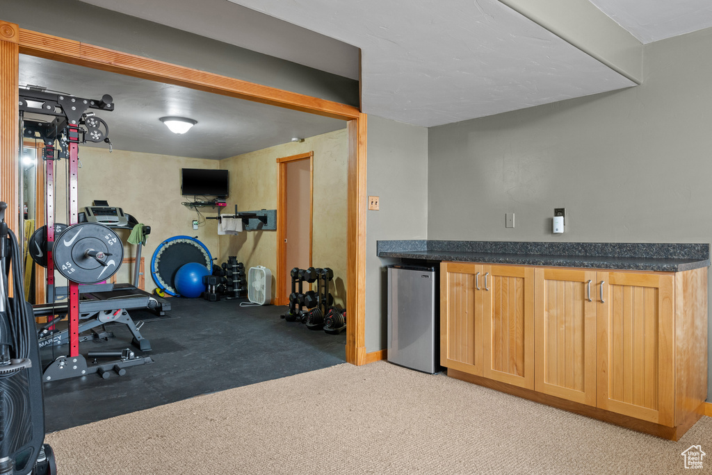 Exercise room featuring a bar