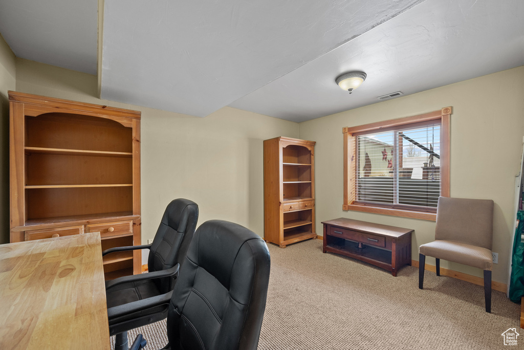 Carpeted office featuring baseboards and visible vents