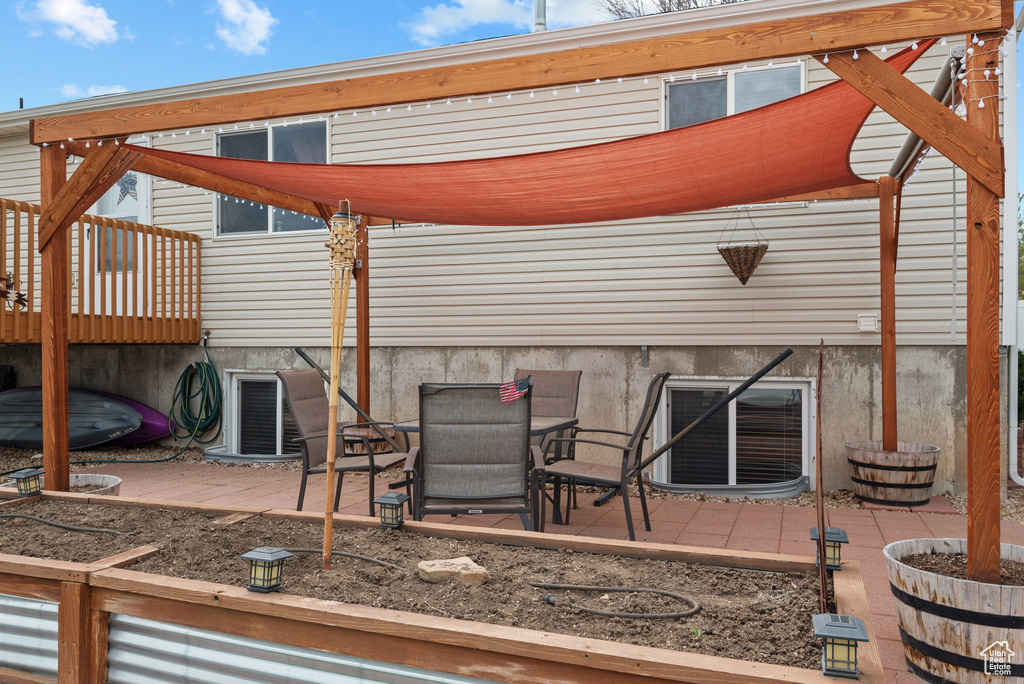 View of patio / terrace with a wooden deck and central air condition unit