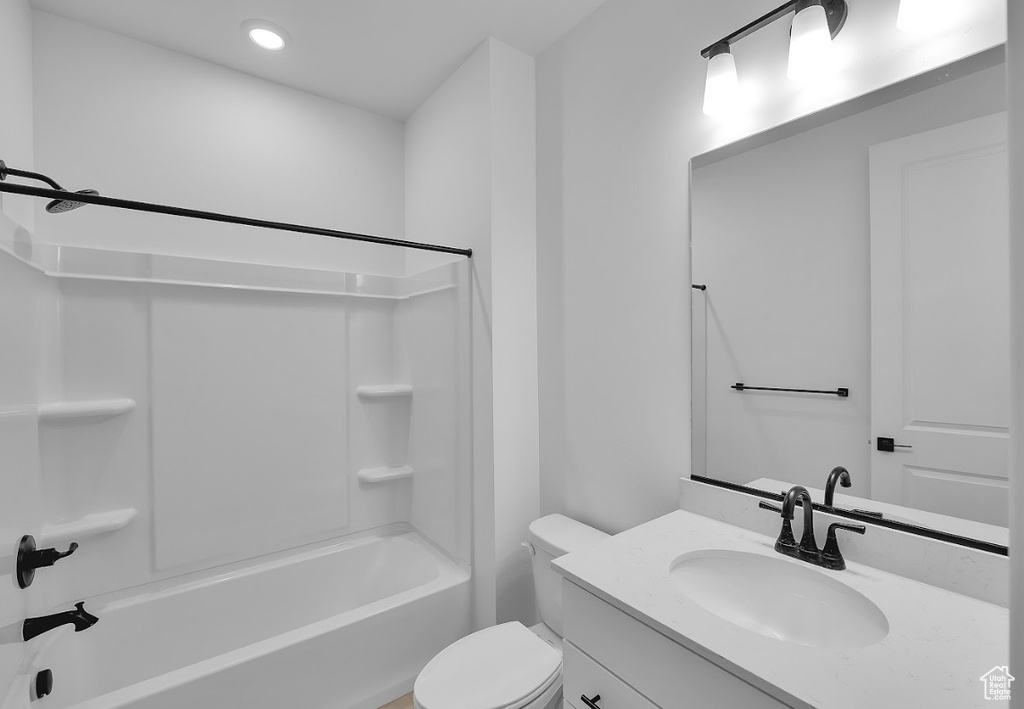 Bathroom with vanity, bathing tub / shower combination, and recessed lighting