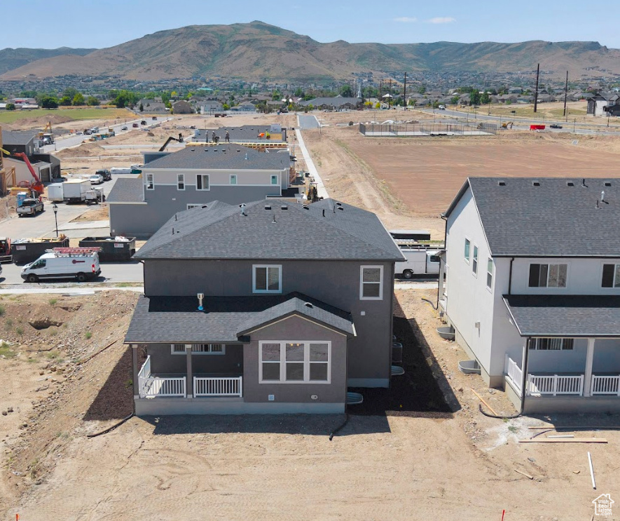 View from above of property with a mountain backdrop