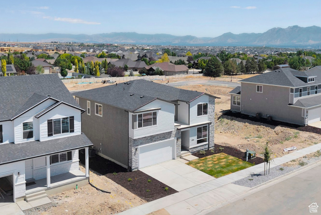 Aerial view of residential area with a mountain backdrop