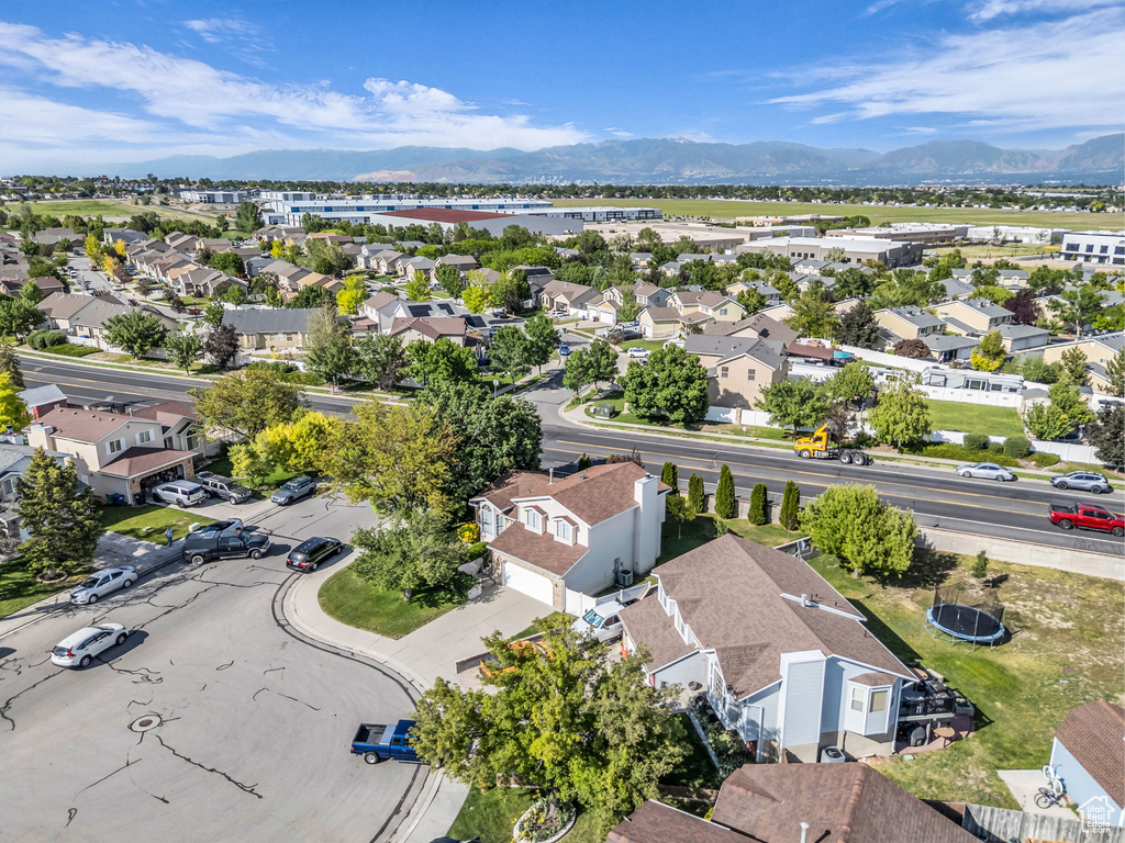 Aerial view of residential area featuring a mountain backdrop