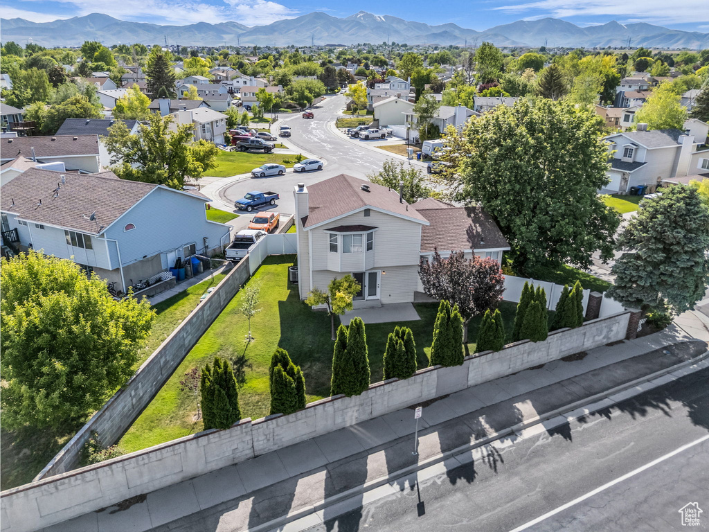 Aerial view of residential area featuring a mountain backdrop