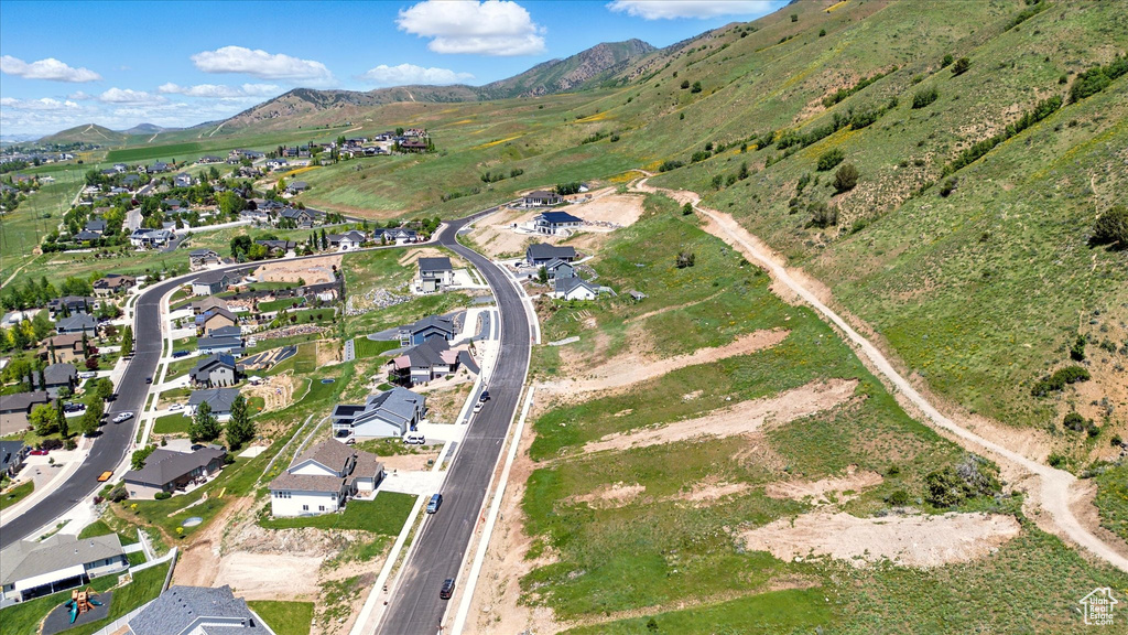 View of property location featuring a mountainous background and nearby suburban area