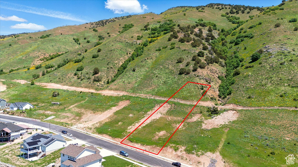 Aerial overview of property\'s location featuring property parcel outlined and mountains