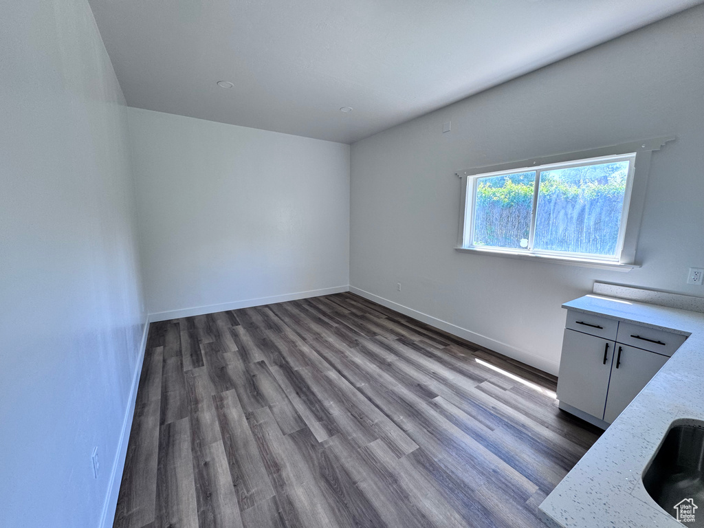 Interior space with wood finished floors and baseboards