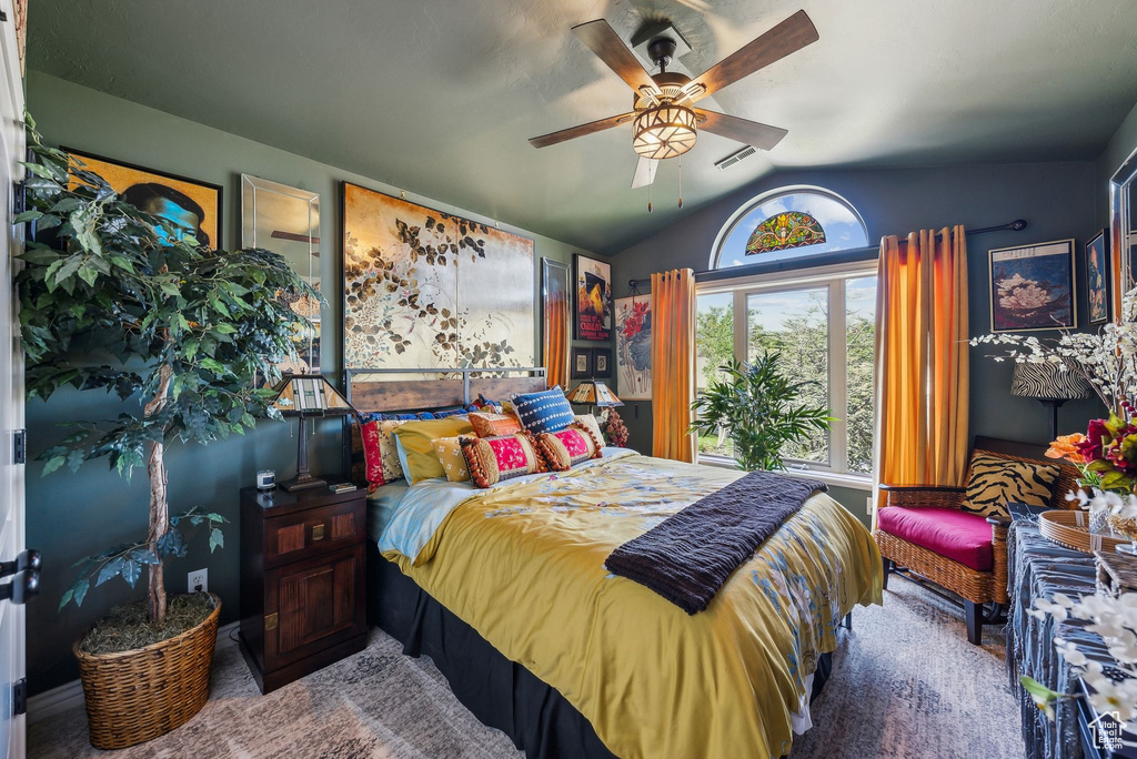 Bedroom featuring vaulted ceiling and ceiling fan