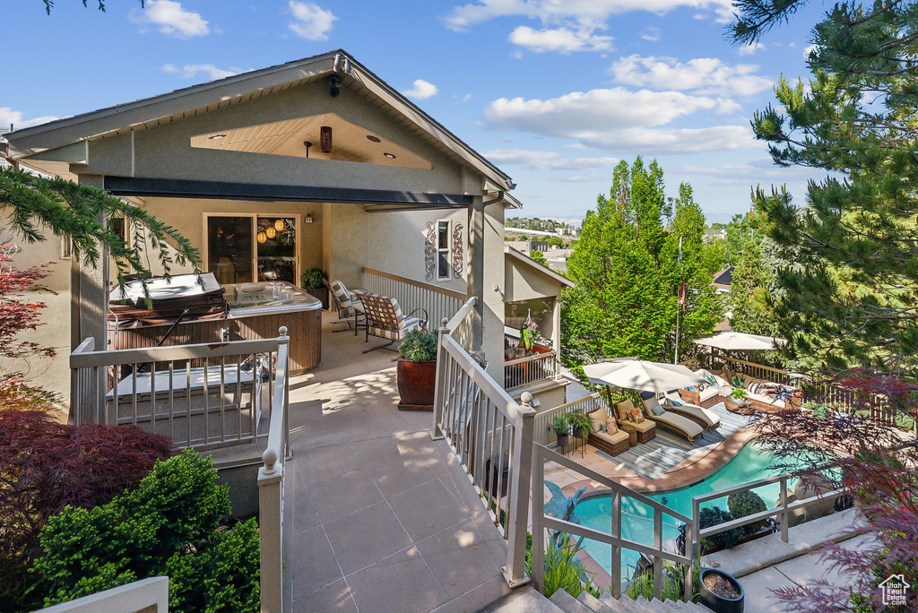 Back of property with a patio and exterior kitchen