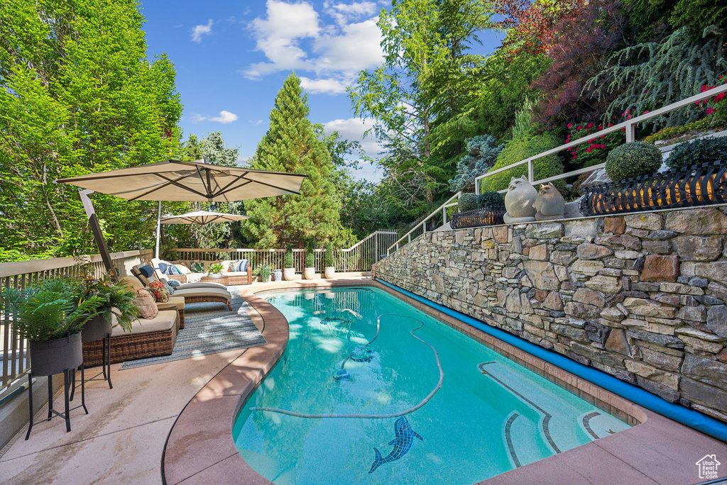 View of swimming pool featuring an outdoor hangout area