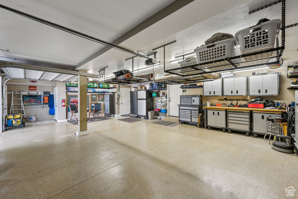 Garage featuring a garage door opener