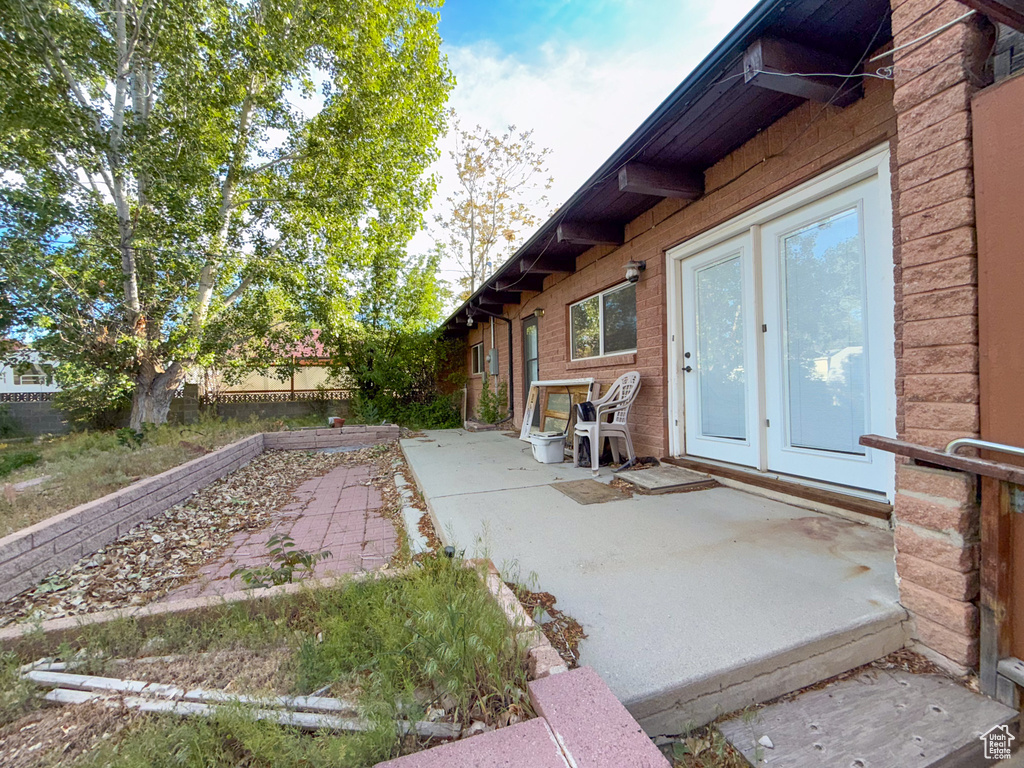 Fenced backyard with a patio area