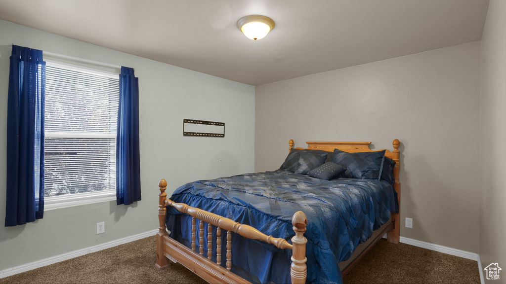 Bedroom with carpet and baseboards