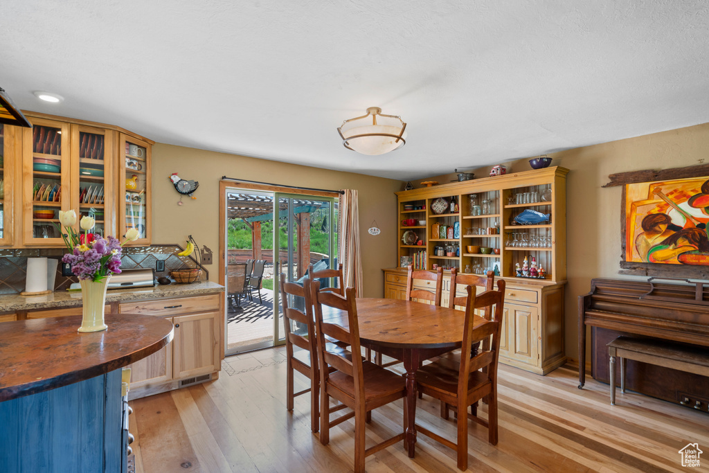 Dining space featuring light wood finished floors