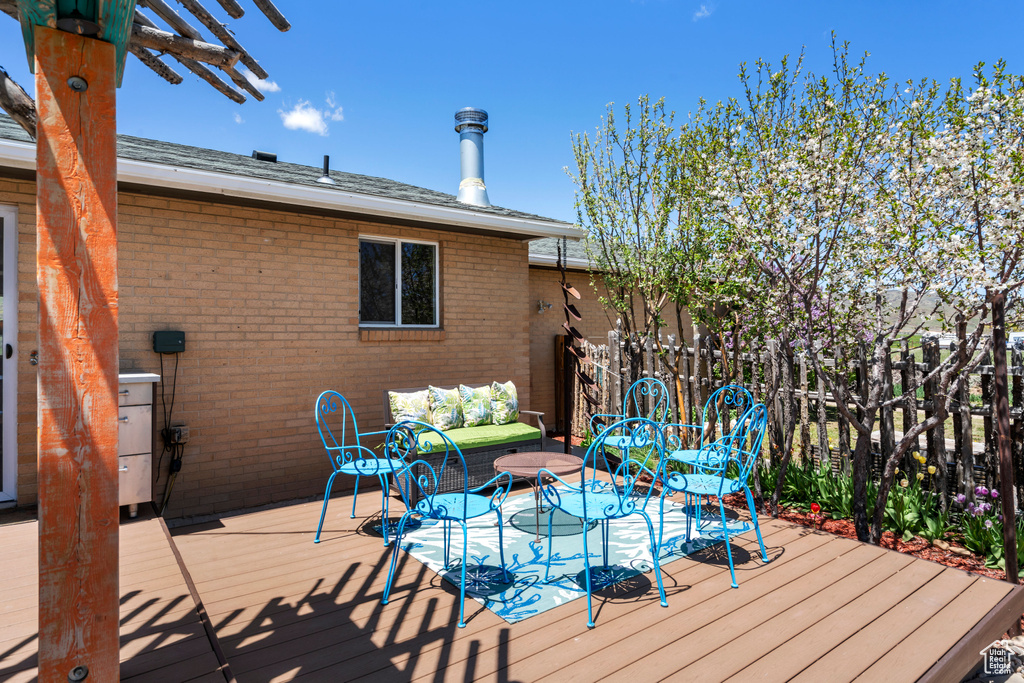 Wooden terrace with an outdoor living space