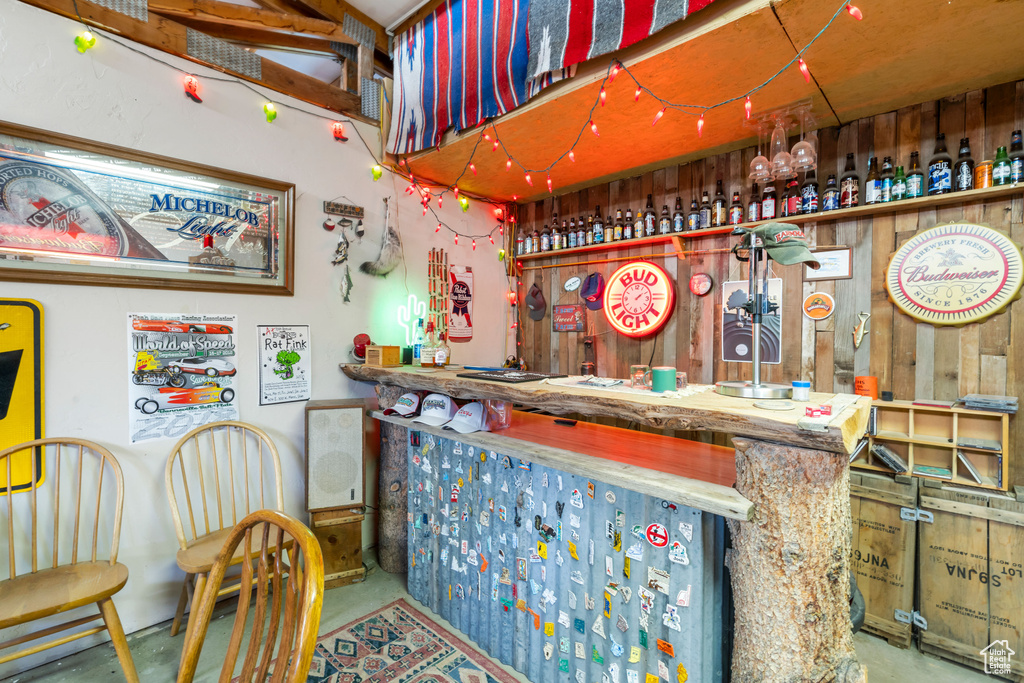Indoor bar featuring concrete flooring