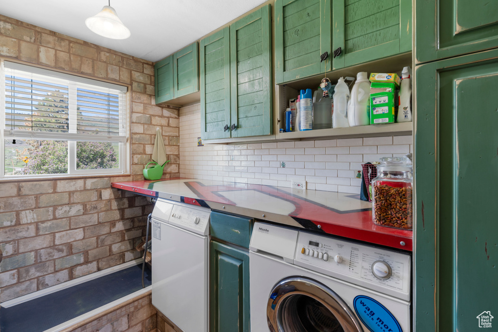 Kitchen with washer and clothes dryer, dishwasher, decorative backsplash, light countertops, and open shelves
