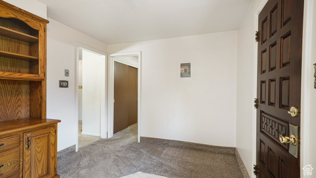 Foyer featuring light carpet