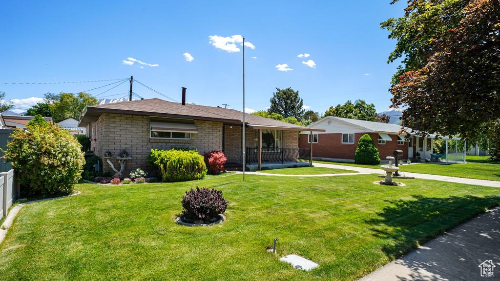 View of front of house featuring roof with shingles