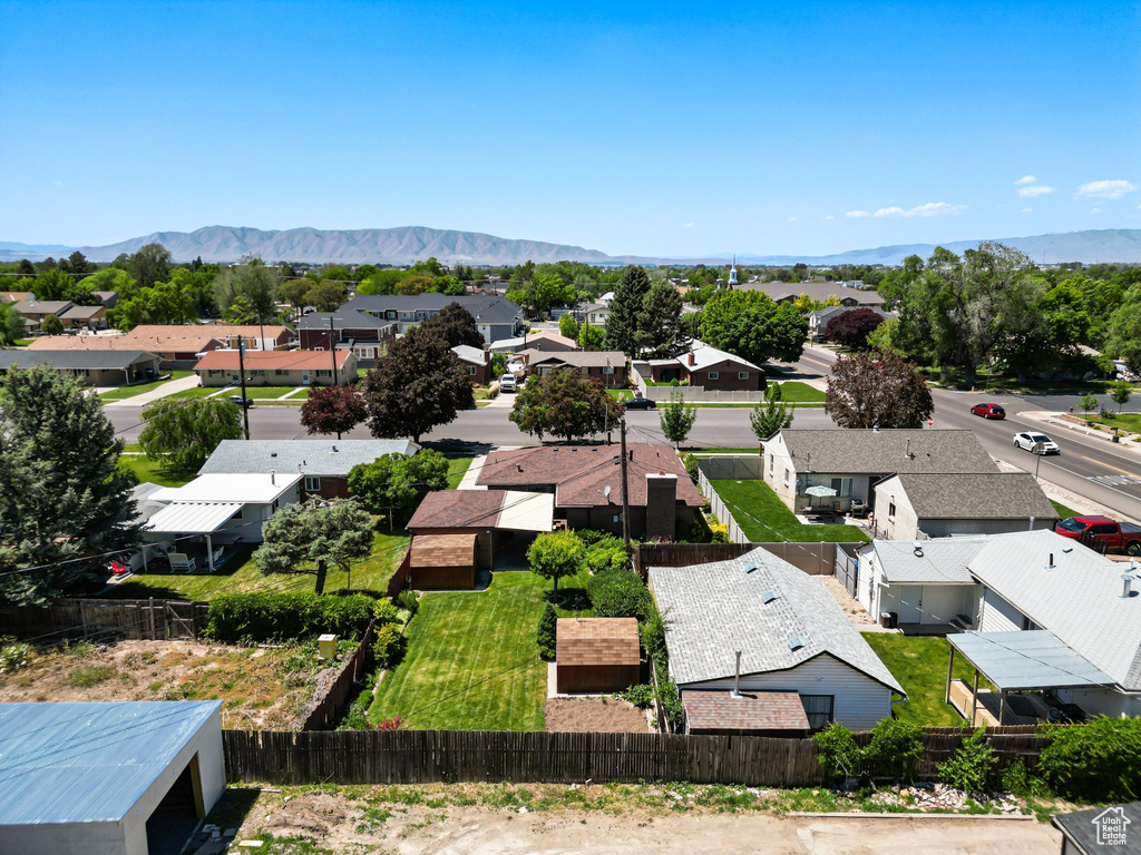 Aerial perspective of suburban area featuring a mountain backdrop