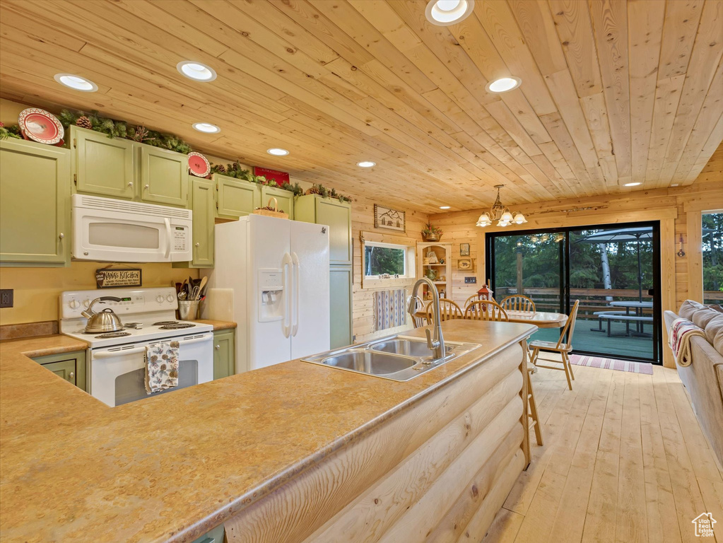 Kitchen with white appliances, a sink, recessed lighting, green cabinets, and wooden ceiling