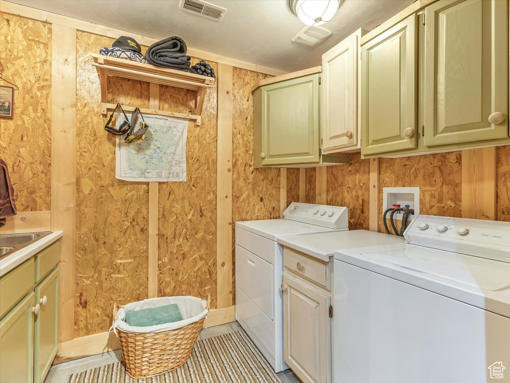 Laundry room with cabinet space and washer and dryer