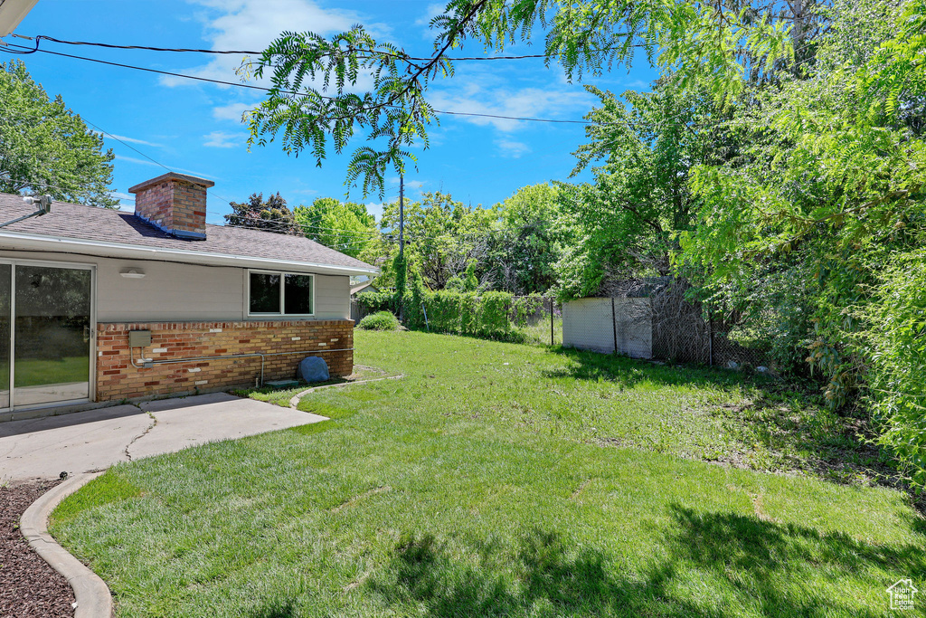 View of yard with a patio area