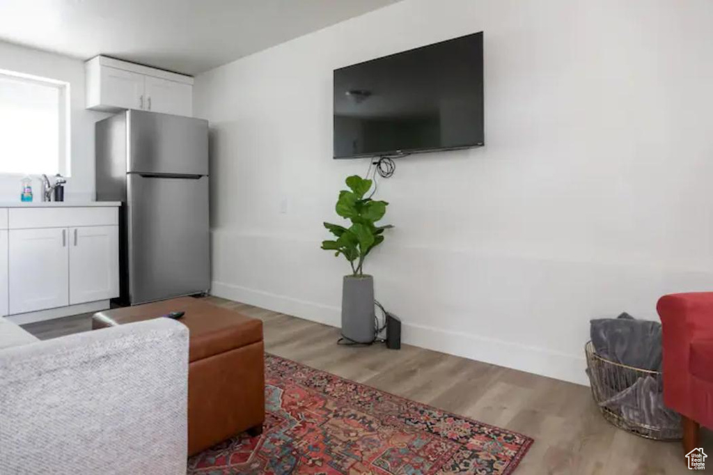 Living area featuring baseboards and wood finished floors