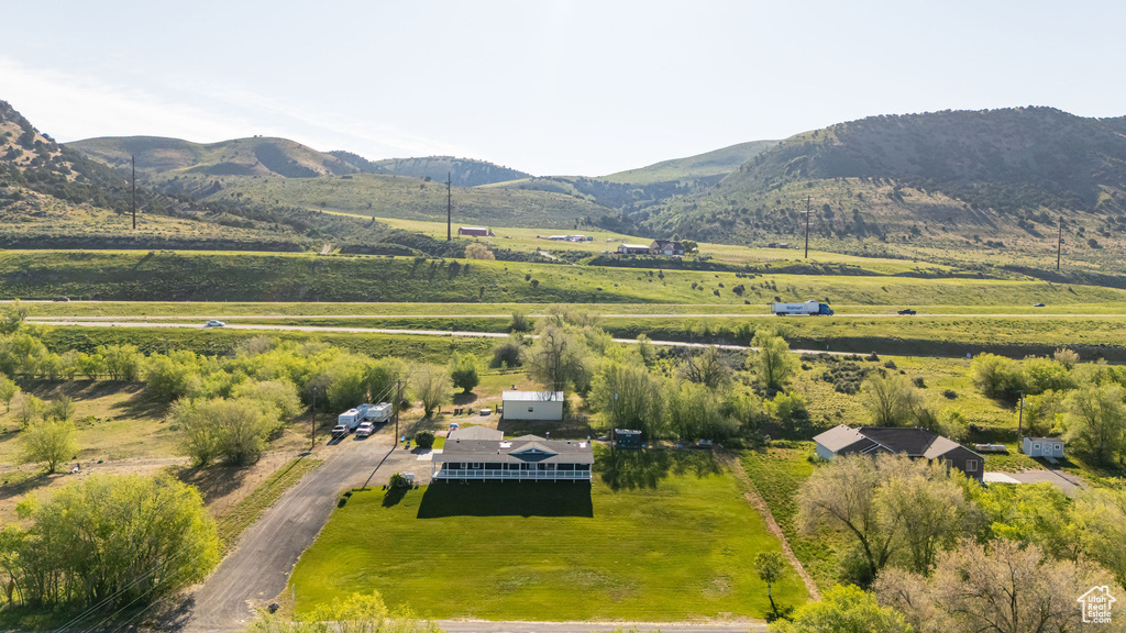 Aerial view of sparsely populated area featuring a mountain backdrop