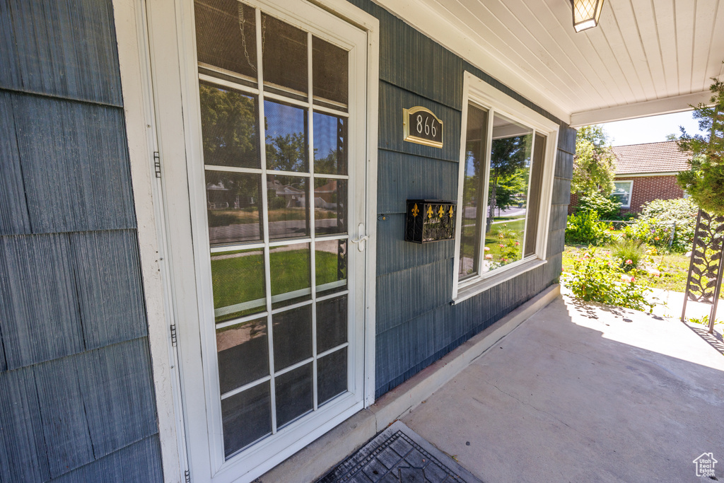 Property entrance with covered porch