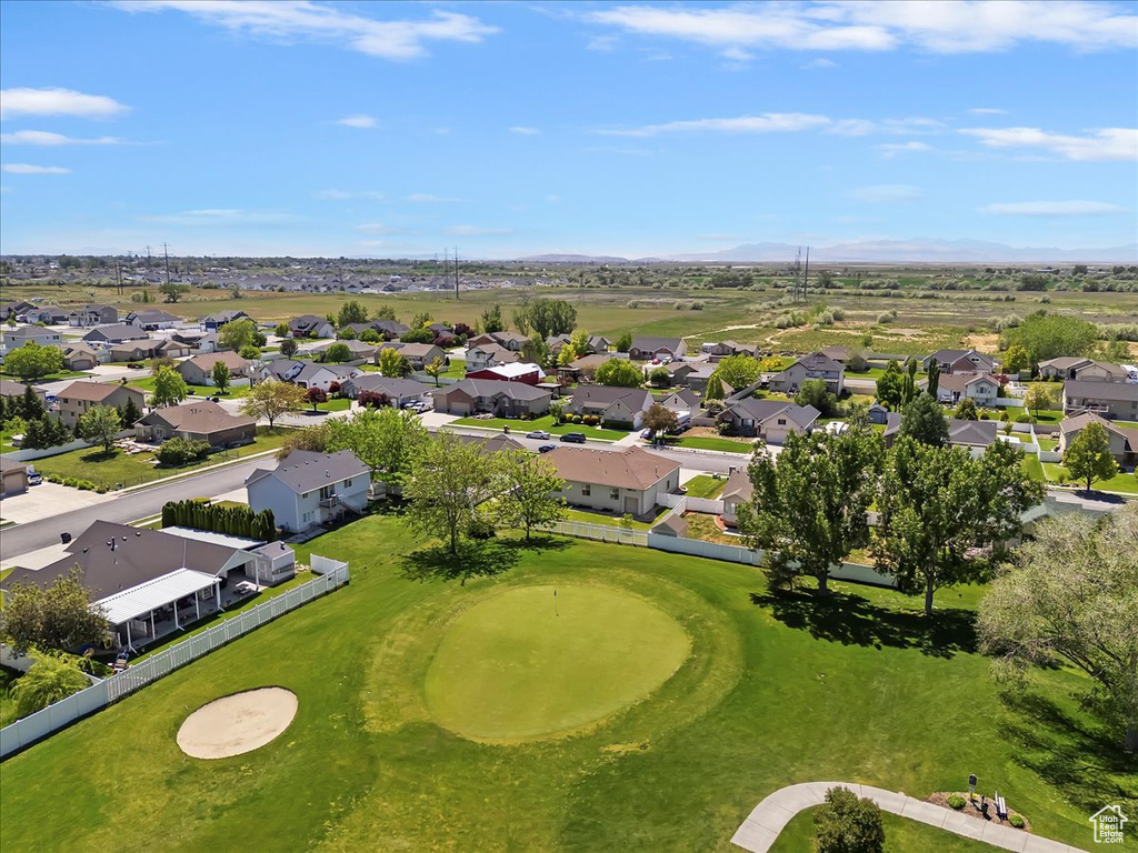 Aerial view of residential area featuring a mountainous background