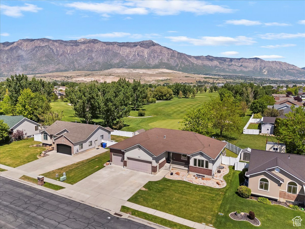 Aerial perspective of suburban area featuring a mountain backdrop