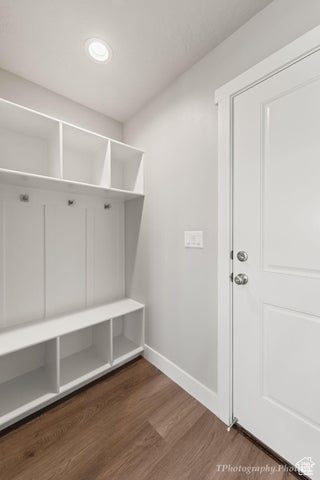 Mudroom featuring baseboards, wood finished floors, and recessed lighting