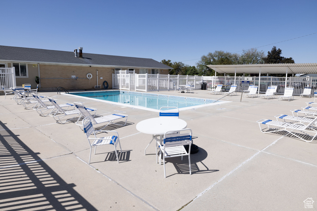 Community pool with a patio area