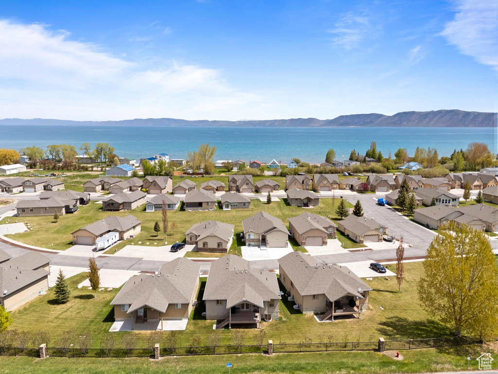 Aerial perspective of suburban area featuring a water and mountain view