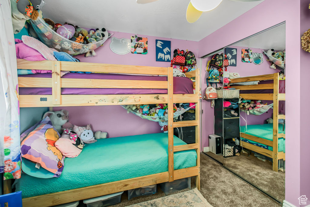 Bedroom featuring carpet and a ceiling fan