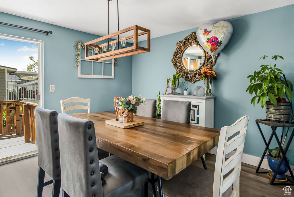 Dining room featuring wood finished floors and baseboards