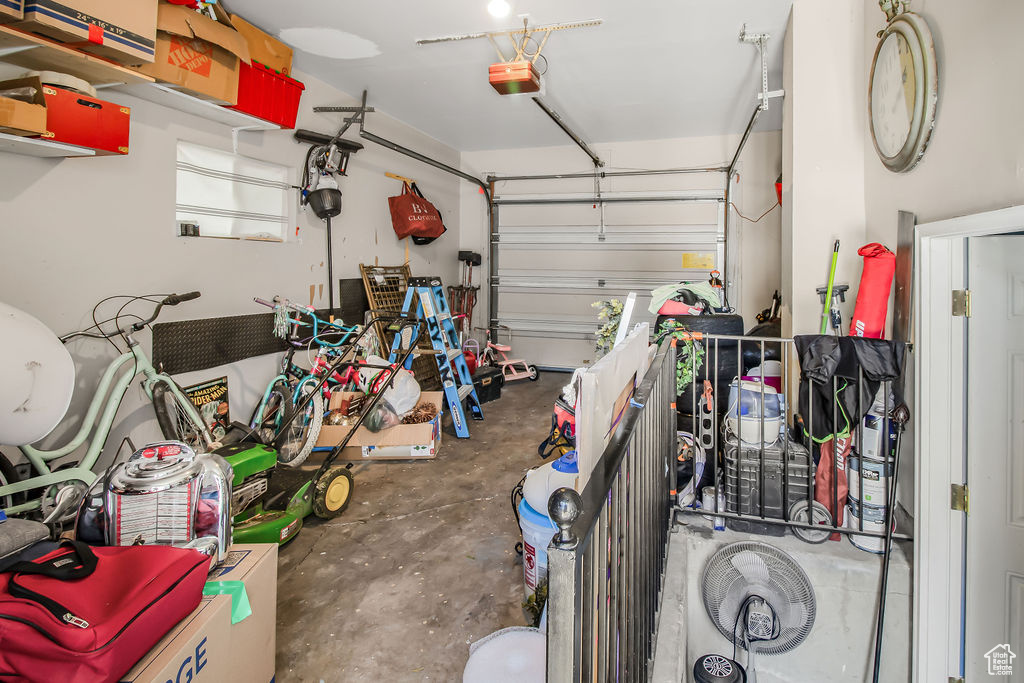 Garage featuring a garage door opener