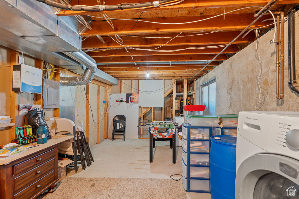 Basement featuring washer / dryer and electric panel