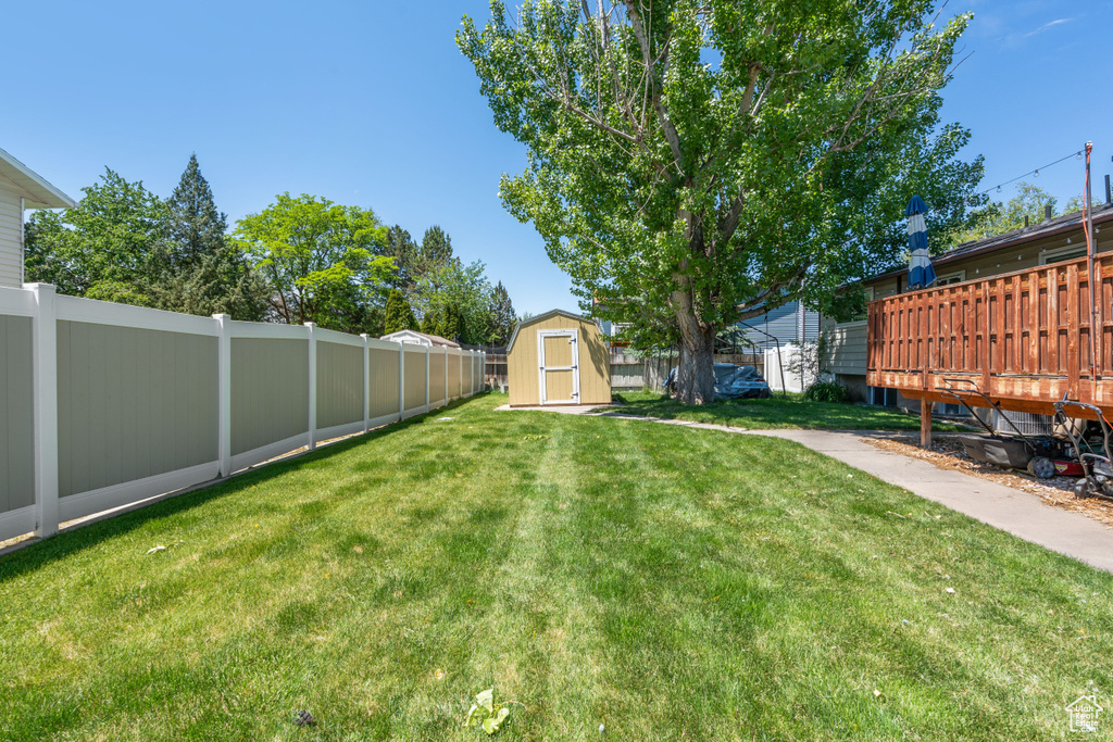 View of yard with a wooden deck